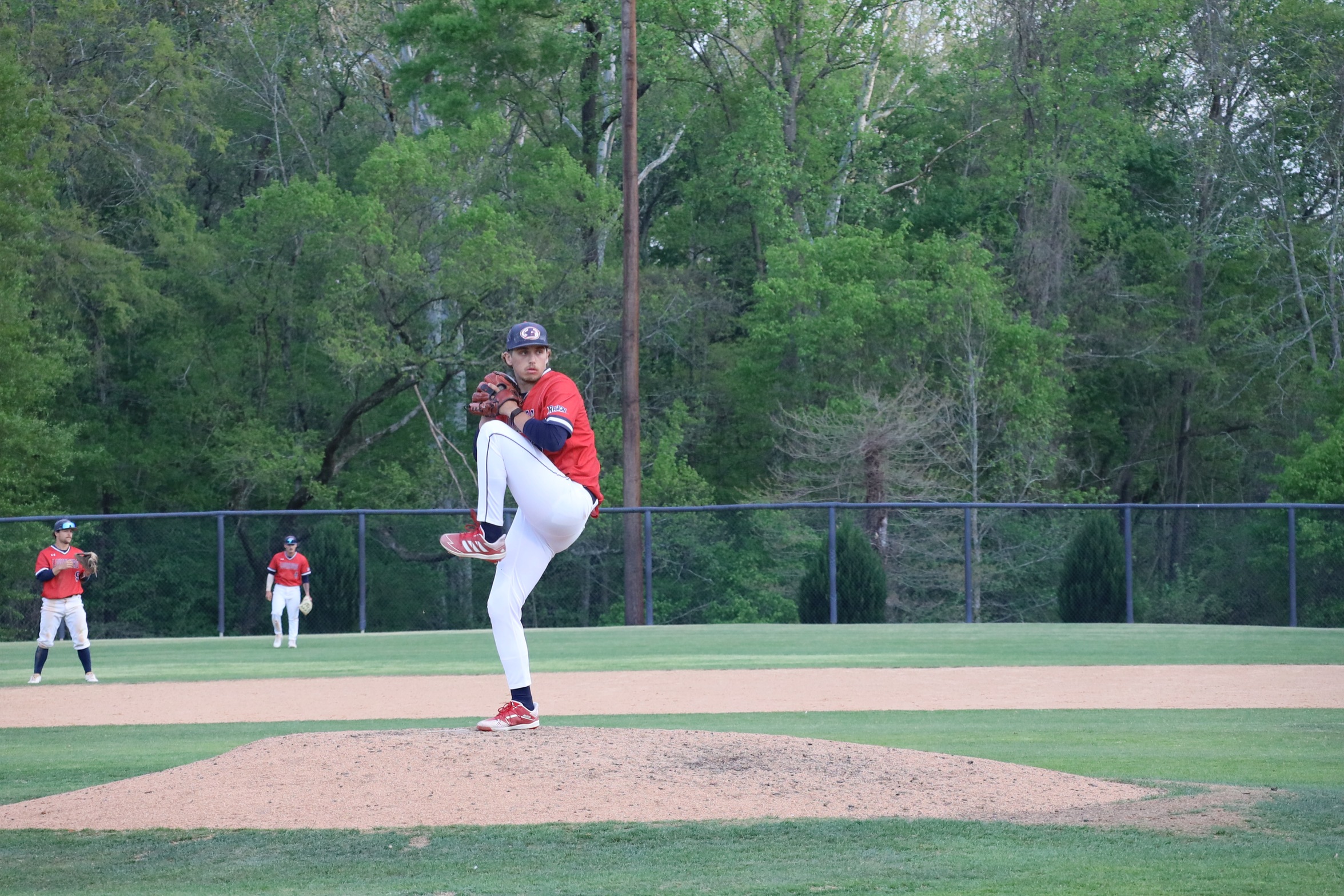 Hurricanes pitcher winds up.