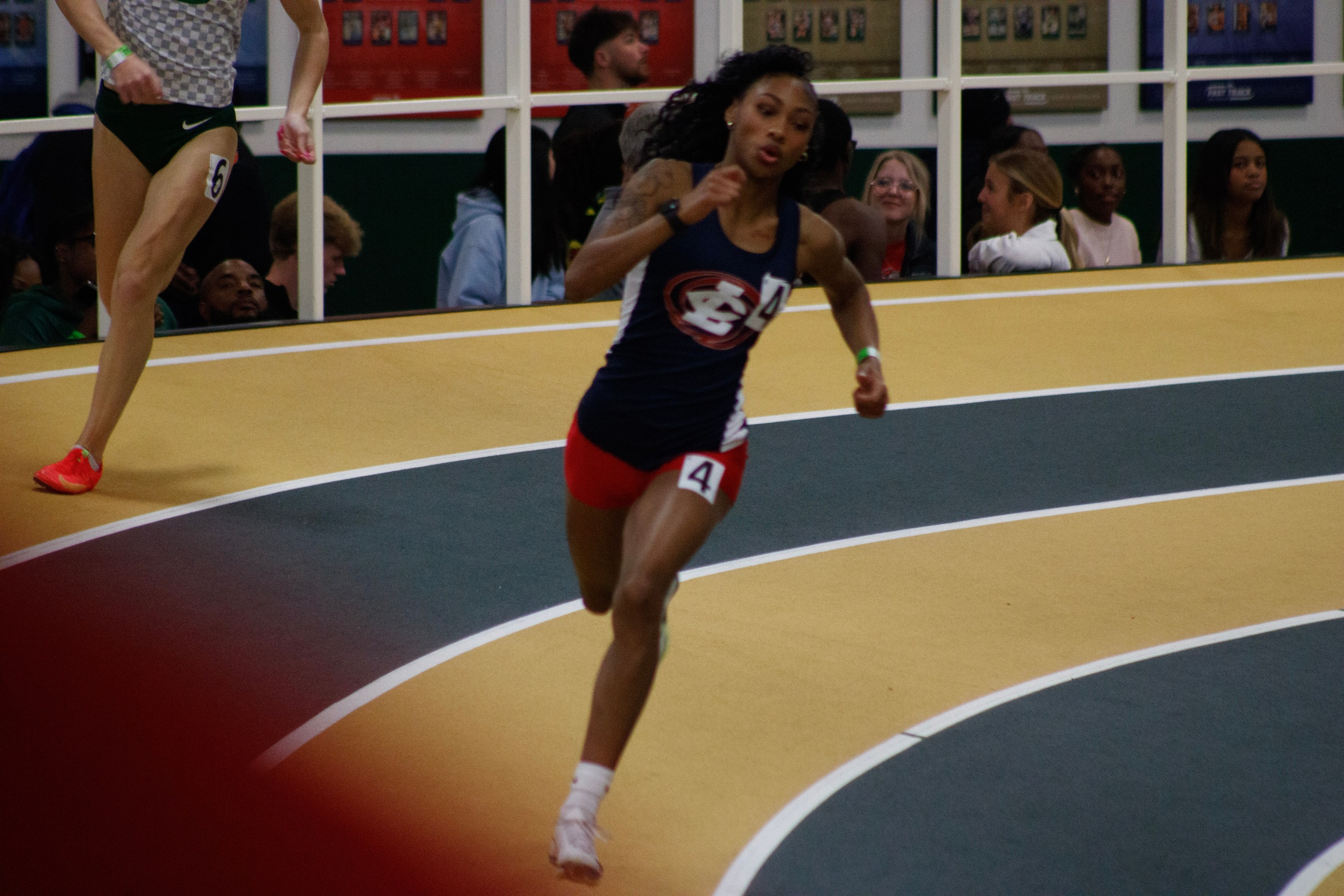 Asiyah Wall sprinting around the corner of the track.